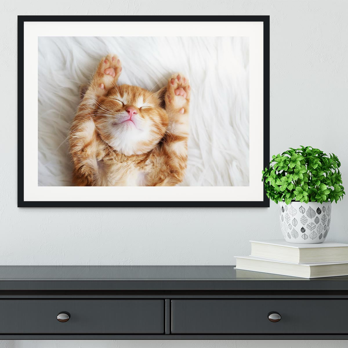 Cute little red kitten sleeps on fur white blanket Framed Print - Canvas Art Rocks - 1