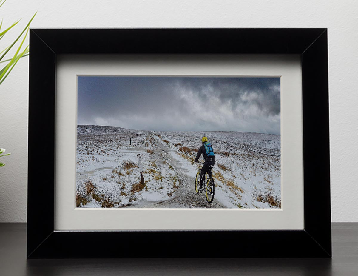 Cycling in the snow Framed Print - Canvas Art Rocks - 1